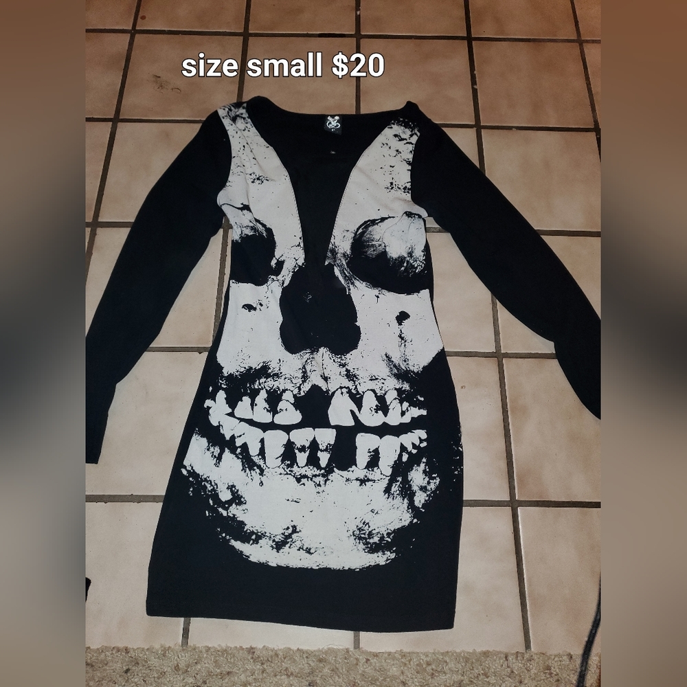 Black long sleeve dress with a skull on it